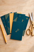 The Fix-It Deck cover — printed repair cards fanned on a desk